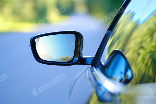 Preview: Focus on rear view mirror of a car