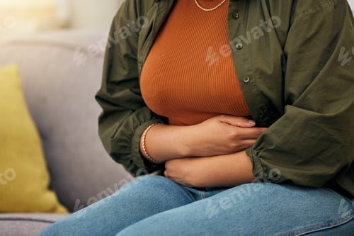 Preview: Sick woman, stomach pain and hands on abdomen for ibs, digestion and nausea of pms, virus or anxiet