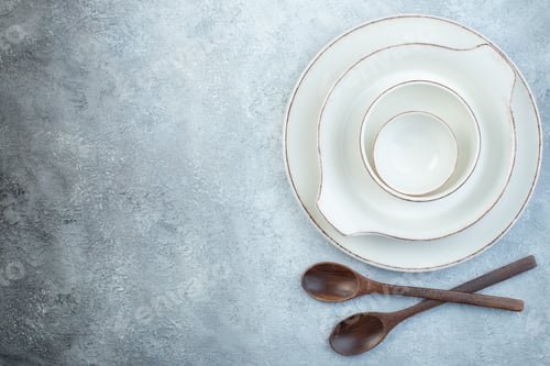 Preview: Elegant empty white set for dinner and wooden spoons on isolated gray background with free space