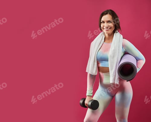 Vista previa: Happy woman, with towel on neck, posing after workout.