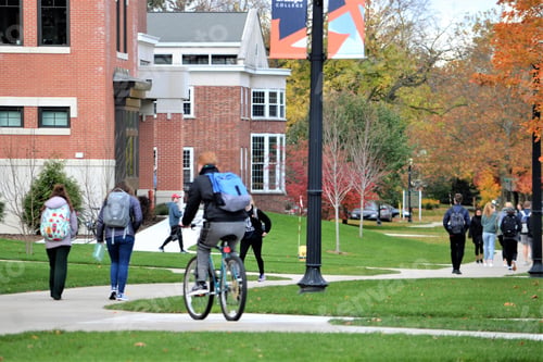 Preview: College students between class on campus in the fall!
