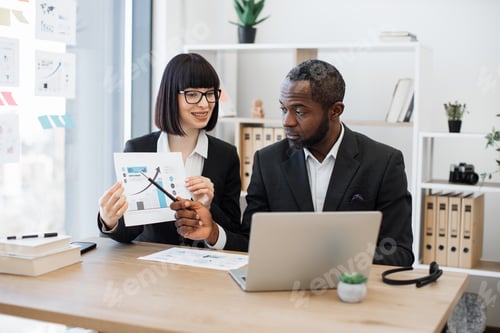 Preview: Professionals holding video conference via laptop at office