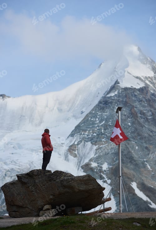 Preview: Tourist standing on huge stone mountains scenery.