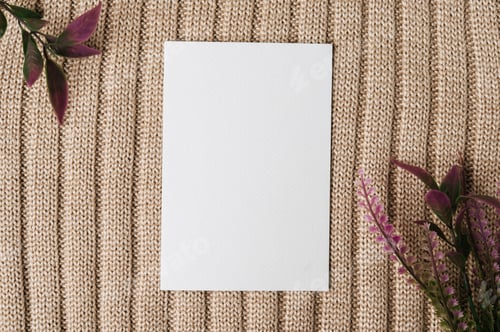 Preview: A blank card and a leaf on a sweater