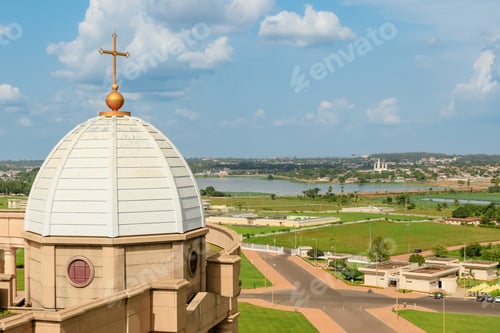 Preview: Basilica of Our Lady of Peace in Yamoussoukro overlooking landscape and waterway