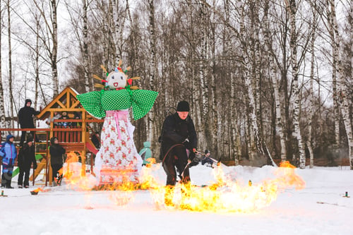 Preview: Fire show performance on Russian ethnic carnival Maslenitsa- Pancake week. Burning Maslenitsa doll
