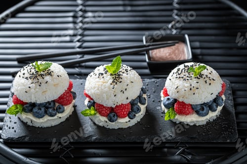 Preview: Delicious sushi burger with raspberries and blueberries as Japanese cuisine.