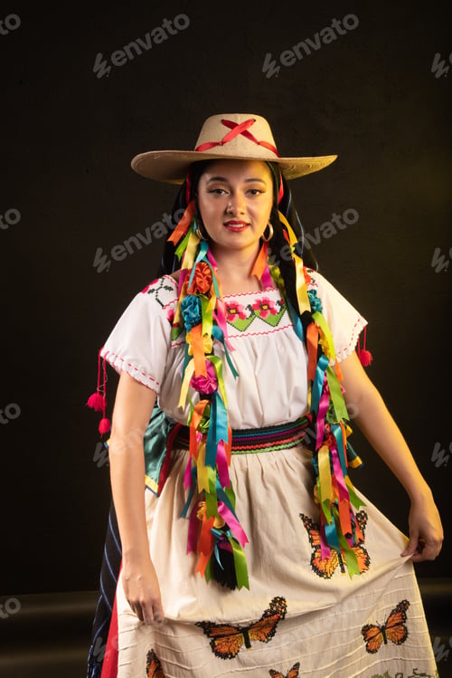 Preview: A woman wearing a colorful dress and a hat with butterflies on it