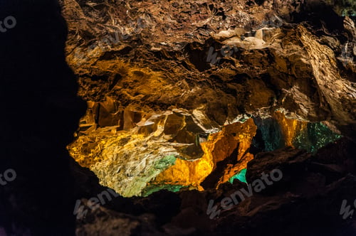 Preview: Closeup shot of the wall texture of Cueva De Los Verdes Punta cave in Spain