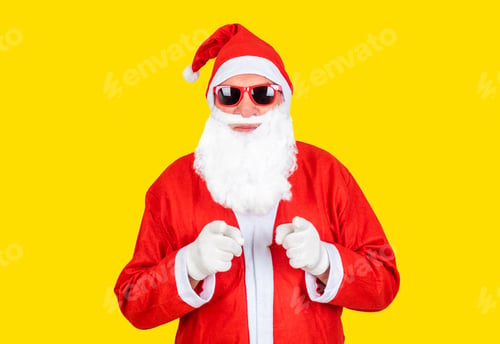 Preview: Santa Claus with sunglasses and hat on yellow background