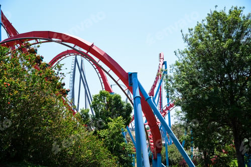 Preview: Inverted roller coaster with narrow metal rails, an ideal summer day to enjoy vacations