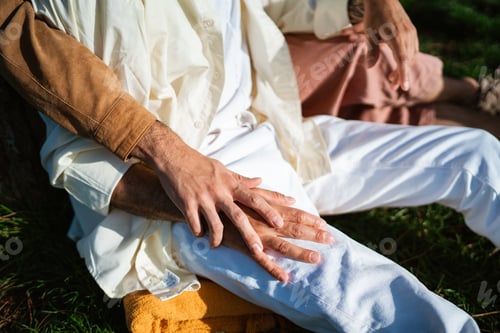 Preview: Crop gay men holding hands in park on sunny day