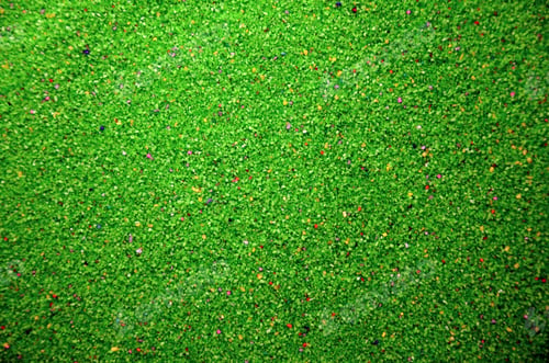 Preview: Texture of a colored granular sand close up. Green grains