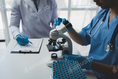 Preview: Scientist working with a microscope Laboratory team doing medical research Scientific test tubes in
