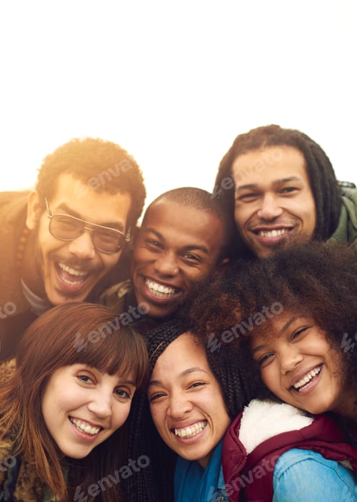 Preview: Friends are the family we choose. Portrait of a happy group of friends posing together outside.