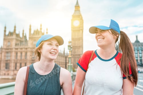 Preview: Happy women tourists in London at Big Ben