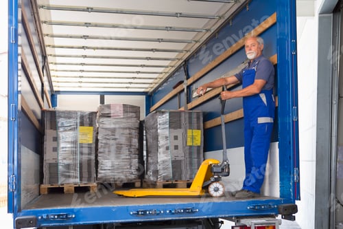 Preview: Factory worker operating pallet jack