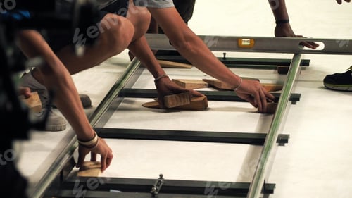 Preview: Behind the scenes of production team setting dolly track.