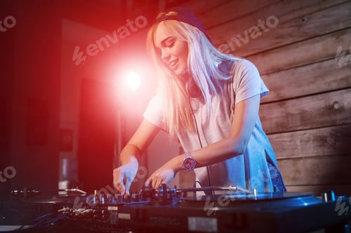 Preview: Cute dj woman having fun playing music at club party