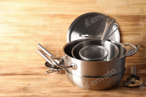 Preview: Kitchen utensil on wooden table, space for text