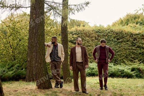 Preview: Stylish men enjoying a serene autumn day in a tranquil field surrounded by nature