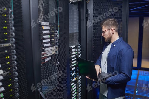 Preview: Technician Working in Data Center Monitoring Equipment