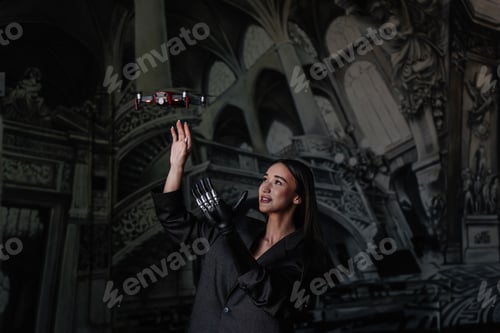 Preview: Innovative woman with robotic hand interacting with drone in ornate historic interior