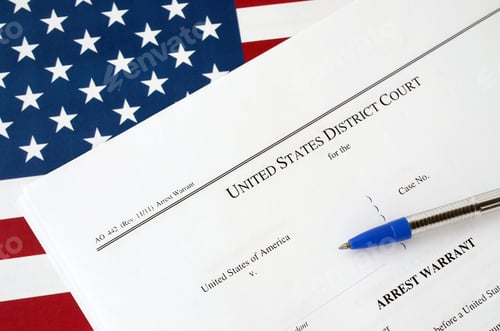 Preview: District Court Arrest Warrant court papers and blue pen on United States flag