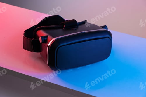 Preview: Black VR glasses mask on neon color background. Virtual reality headset