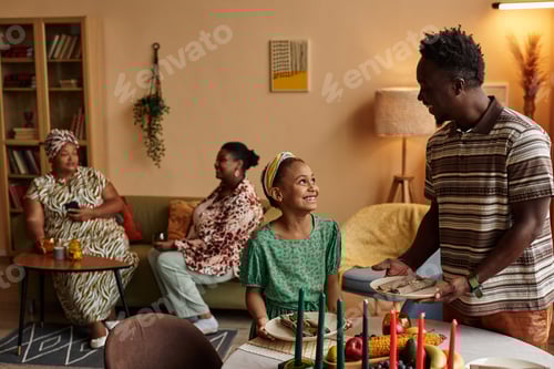 Preview: Girl Helping Father to Bring Plates