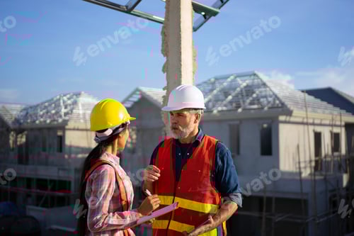 Preview: Blue collar workers are building house.