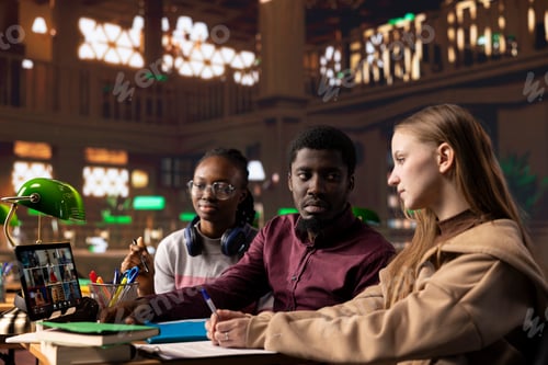 Preview: Young group of students engaging in a remote webinar course on tablet