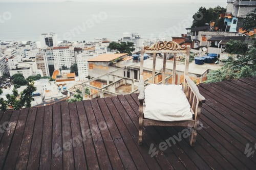 Preview: Rustic chair on deck with city view