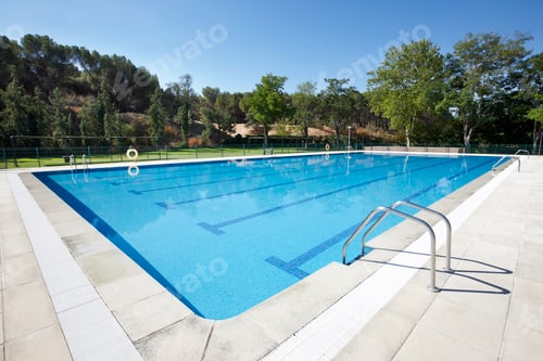 Preview: Outdoor swimming pool surrounded by trees. Recreation area. Copy space