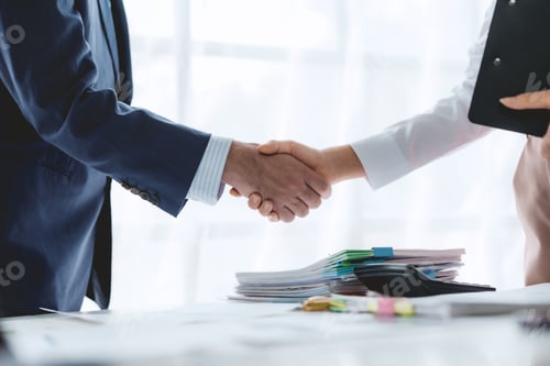 Preview: Business success. Business people handshake agreement confirmed in the investment business.