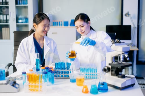 Preview: Young scientists conducting research investigations in a medical laboratory, a researcher