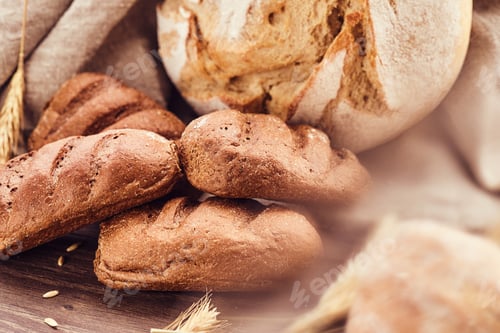 Preview: Delicious freshly bakery products on wooden background.