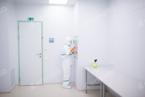 Preview: Scientist Working in Lab Wearing a Protective Suit