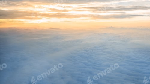 Preview: Aerial traveling. Flying at dusk or dawn. Fly through orange cloud and sun.