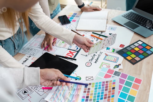 Preview: UI designer and UX developer brainstorm idea to design the application appearance in the early stage