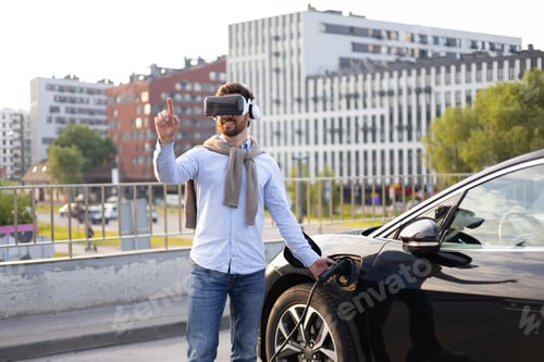 Preview: Man in VR Charging Electric Car