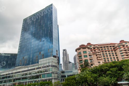 Preview: General view from Singapore skyscrapers and flats among green streets