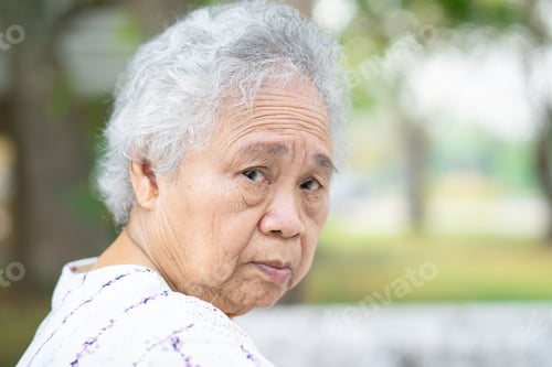 Preview: Asian senior or elderly old lady woman sitting in park, healthy strong medical concept.