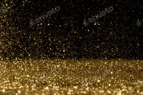 Preview: Beautiful, sparkling golden glitter pouring down from above on a dark background