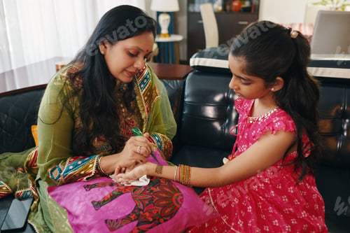 Preview: Mom Making Ornament On Hand From Henna