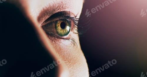 Preview: Endless possibilities lie ahead. Closeup shot of man opening his eyes against a dark background.