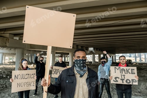 Preview: Activists holding signs at rally in protest