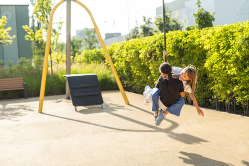 Preview: A schoolgirl plays on the playground in the city's backyard.