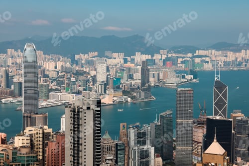 Preview: Victoria Bay skyline in Hong Kong showcasing modern architecture and bustling harbor activities