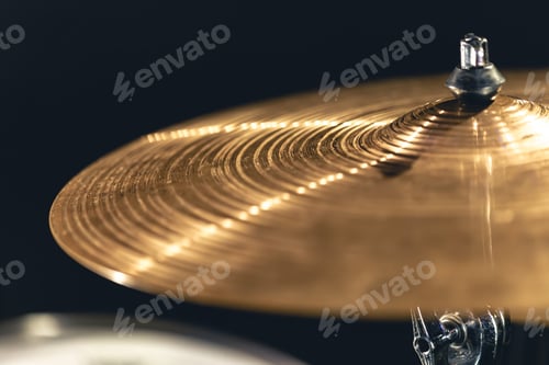 Preview: Drum cymbal close-up on a dark background.